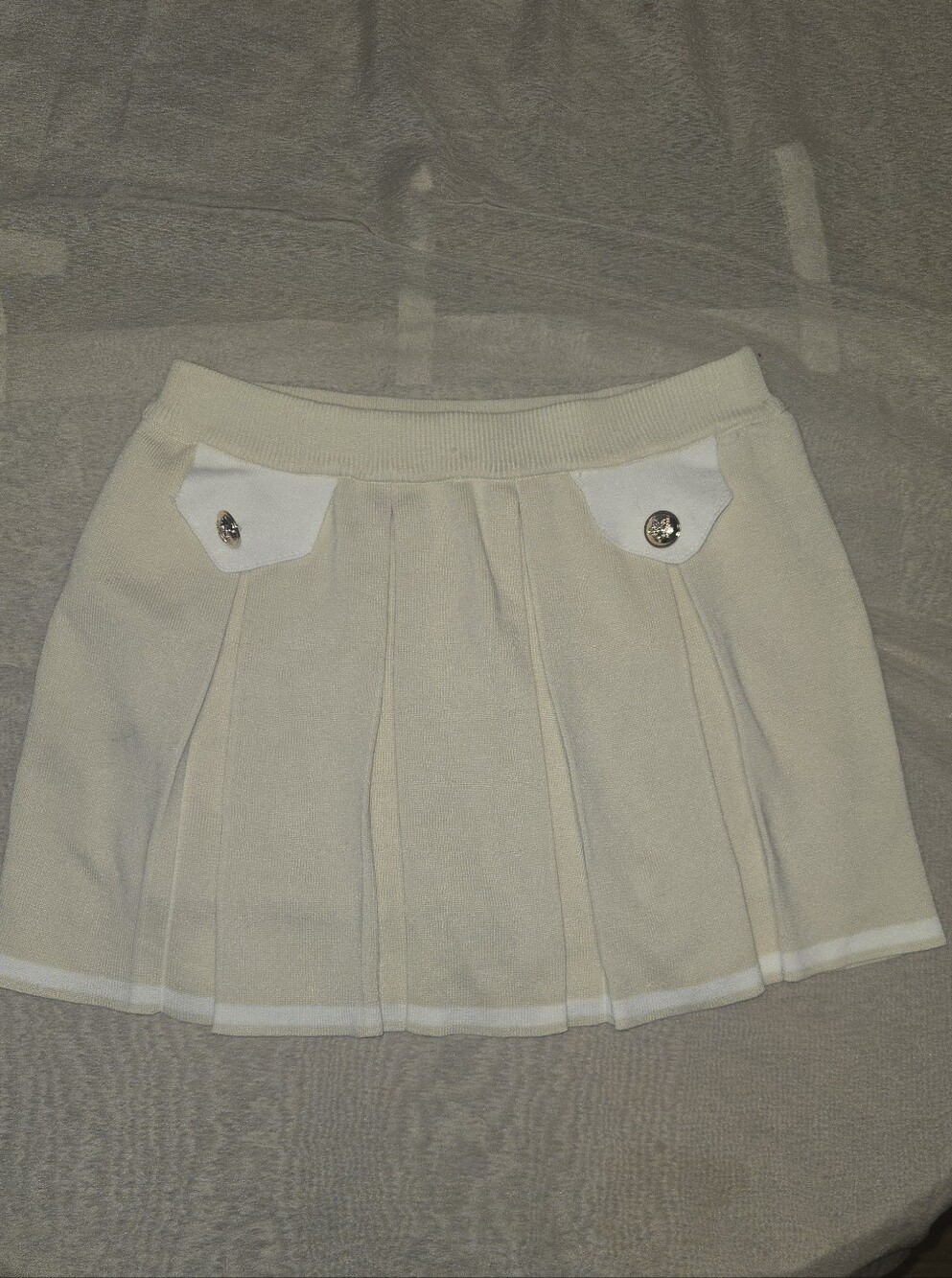 Daisy Cream Pleated Skater Mini Skirt with Button Pocket Accents